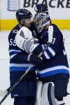 John Woods / The Canadian Press files
Jets Mark Scheifele (left) and Connor Hellebuyck will play alongside the NHL’s best at the all-star game on Jan. 25 in St. Louis.