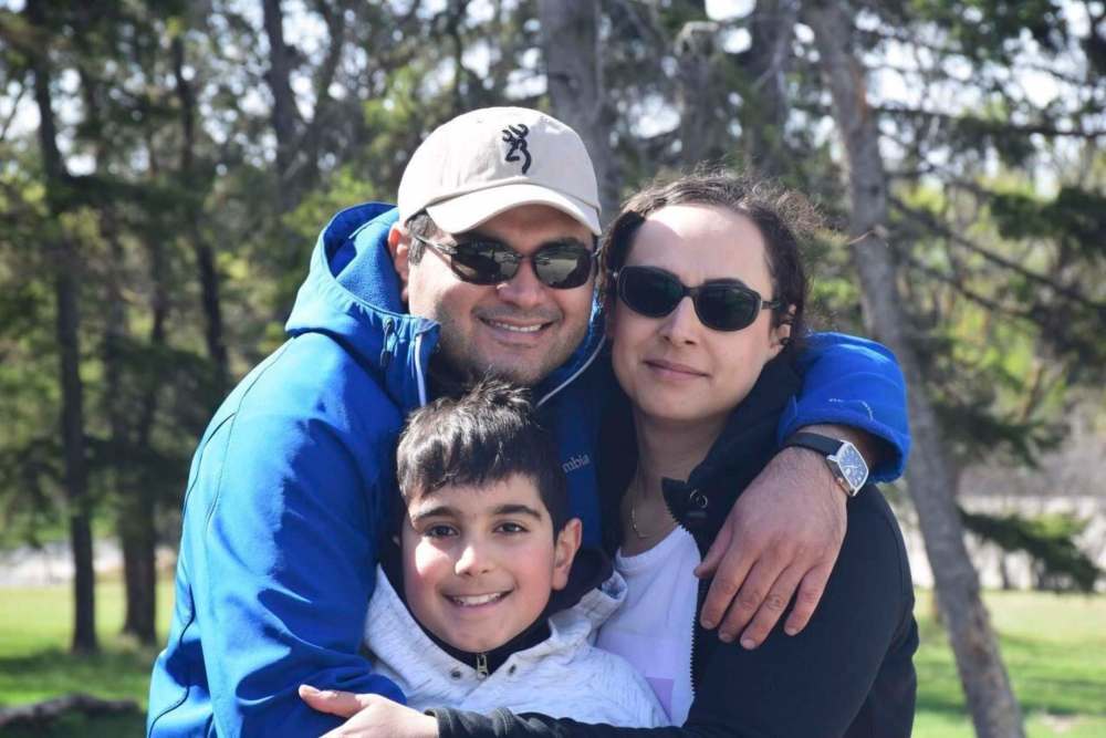 Abolfazl Sadr with wife Farzaneh Naderi and son Noojan Sadr. Farzaneh and Noojan were killed in the crash of a Ukrainian International Airlines jet moments after takeoff from Tehran, Iran Wednesday. Farzaneh was employed as a tutor at St. Amant Centre. (Supplied)