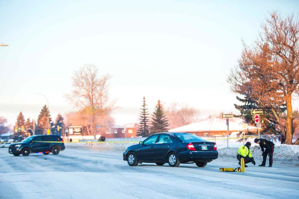 A man was hit by a car on Ness Avenue at Harcourt Street Wednesday about 6:30 a.m. He survived and was in stable condition in hospital Wednesday afternoon. (Mikaela MacKenzie / Winnipeg Free Press)