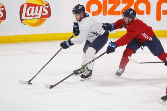 MIKE DEAL / WINNIPEG FREE PRESSWinnipeg Jets Nikolaj Ehlers, left, and Neal Pionk compete during practice at Bell MTS Place Thursday afternoon.