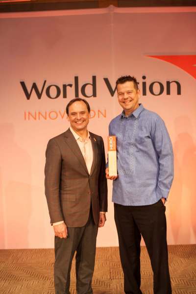 Pastor Ed Buller (right) with World Vision president and CEO Michael Messenger.