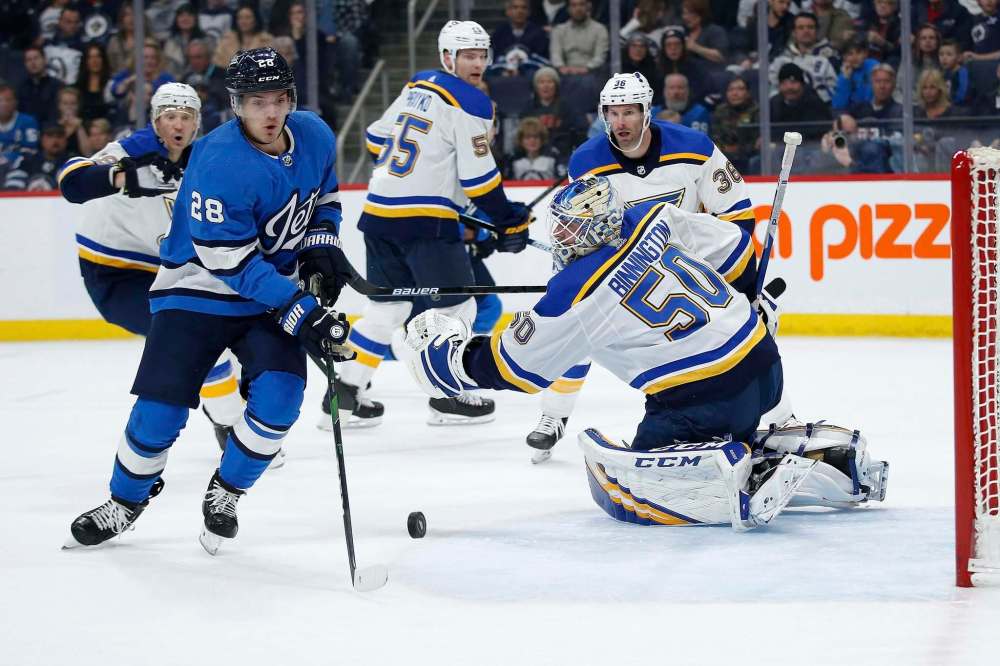 Jack Roslovic scores one of his two goals Friday.
