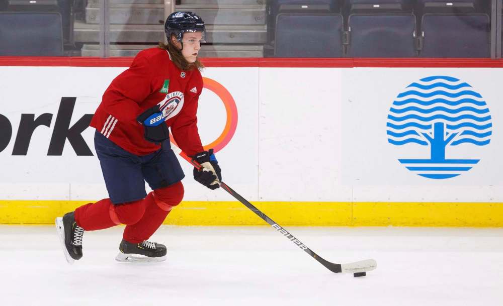 Winnipeg Jets defenceman Sami Niku moves the puck during practice at Bell MTS Place Monday. (Mike Deal / Winnipeg Free Press)