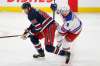 JOHN WOODS / WINNIPEG FREE PRESS
New York Rangers' Jacob Trouba tries to get around Winnipeg Jets’ Blake Wheeler during the first period in Winnipeg on Tuesday.