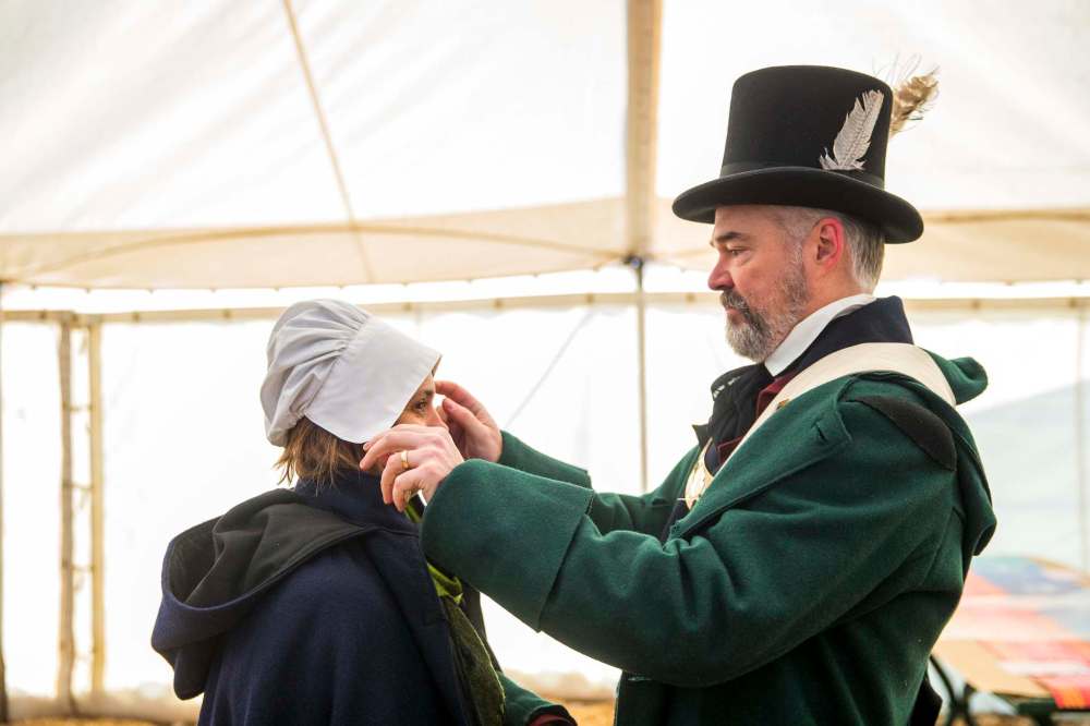 Robert Régnier fixes Liliane Régnier's cap before the Festival's press conference. (Mikaela MacKenzie / Winnipeg Free Press)