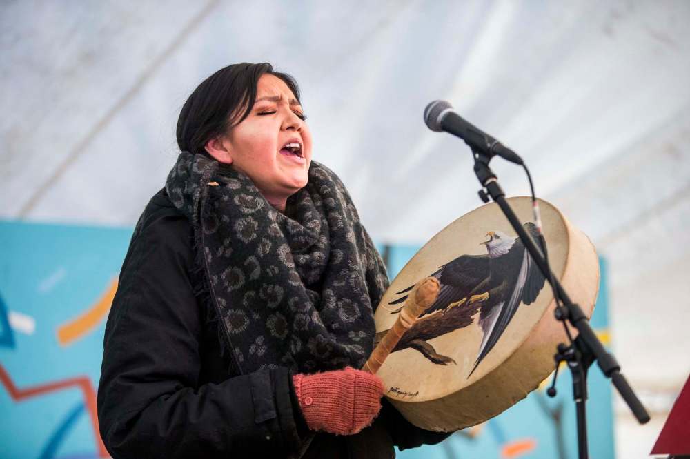 Lisa Muswagon performs an honour song at the Festival du Voyageur kickoff event. She will be appearing at this year's festival. (Mikaela MacKenzie / Winnipeg Free Press)