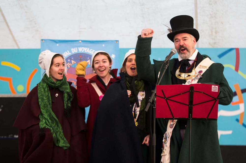 Festival du Voyageur official family members Anne-Sophie (from left), Jasmine, Liliane and Robert Régnier raise their fists with a