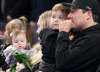 JONATHAN HAYWARD / THE CANADIAN PRESS
Scott Jenkins, husband of the late Saskatchewan player Aly Jenkins reacts alongside family including his three children Brady, Avery and Sydney during a tribute to his wife prior to the 4th draw at the Scotties Tournament of Hearts in Moose Jaw, Sask., Sunday, Feb. 16, 2020.