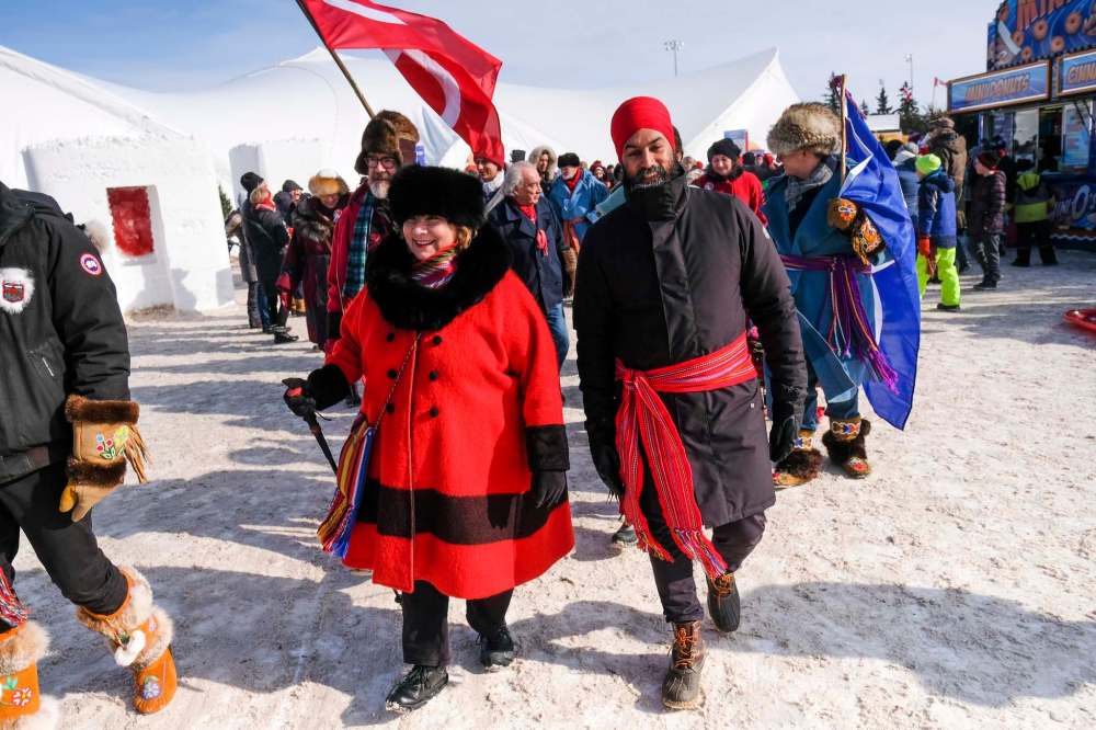 Daniel Crump / Winnipeg Free Press
NDP Leader Jagmeet Singh (right) and Paulette Dugauy (left) lead the Métis parade at Festival du Voyageur to celebrate Louis Riel Day.