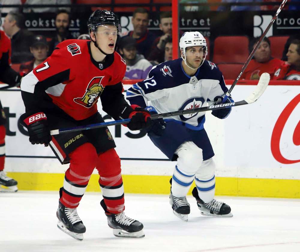 THE CANADIAN PRESS/Fred Chartrand
Winnipeg Jets defenceman Dylan DeMelo, right, plays against former Ottawa Senators teammate Brady Tkachuk in Ottawa on Thursday.