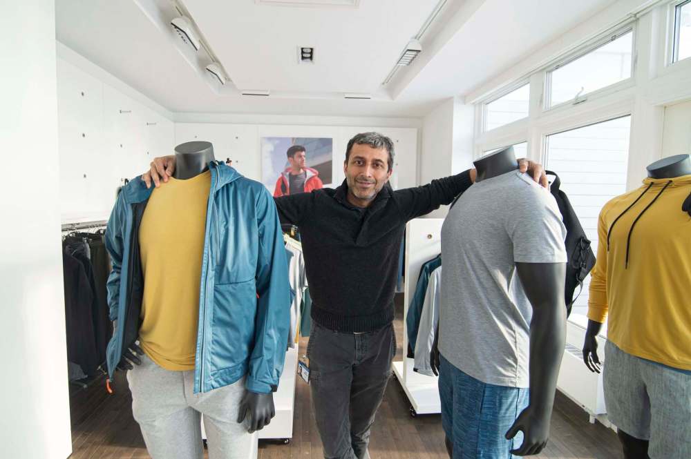 Mike Sudoma / Winnipeg Free Press
Mondetta Clothing CEO Ash Modha shows off some of the Winnipeg-based company’s popular clothing on Friday.