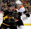 Gene J. Puskar / The Associated Press
Pittsburgh Penguins’ Sidney Crosby, left, battles for position with Philadelphia Flyers’ Nolan Patricklast season. Patrick is recovering from a migraine disorder that has kept him out of the Philadelphia lineup since training camp.