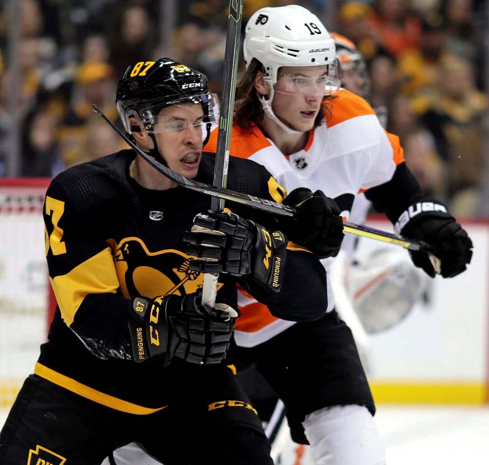 Gene J. Puskar / The Associated Press
Pittsburgh Penguins’ Sidney Crosby, left, battles for position with Philadelphia Flyers’ Nolan Patricklast season. Patrick is recovering from a migraine disorder that has kept him out of the Philadelphia lineup since training camp.