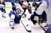 Winnipeg Jets forward Cody Eakin and Buffalo Sabres forward Marcus Johansson battle over the puck during a faceoff in the second period. (Jeffrey T. Barnes / The Associated Press)
