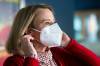 MIKAELA MACKENZIE / WINNIPEG FREE PRESS Epidemiologist Cynthia Carr demonstrates wearing a KN95 mask, which is recommended to combat the omicron variant.