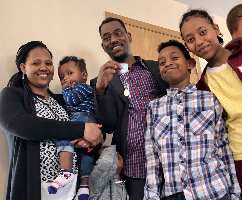 Sembetu Ghabr (from left) withone-year-old Gedna, Weldeyesus, Zekarias, Matias and Delina smile after receiving the keys of their first home in Canada thanks to Habitat for Humanity. (Maan Alhmidi / Winnipeg Free Press)