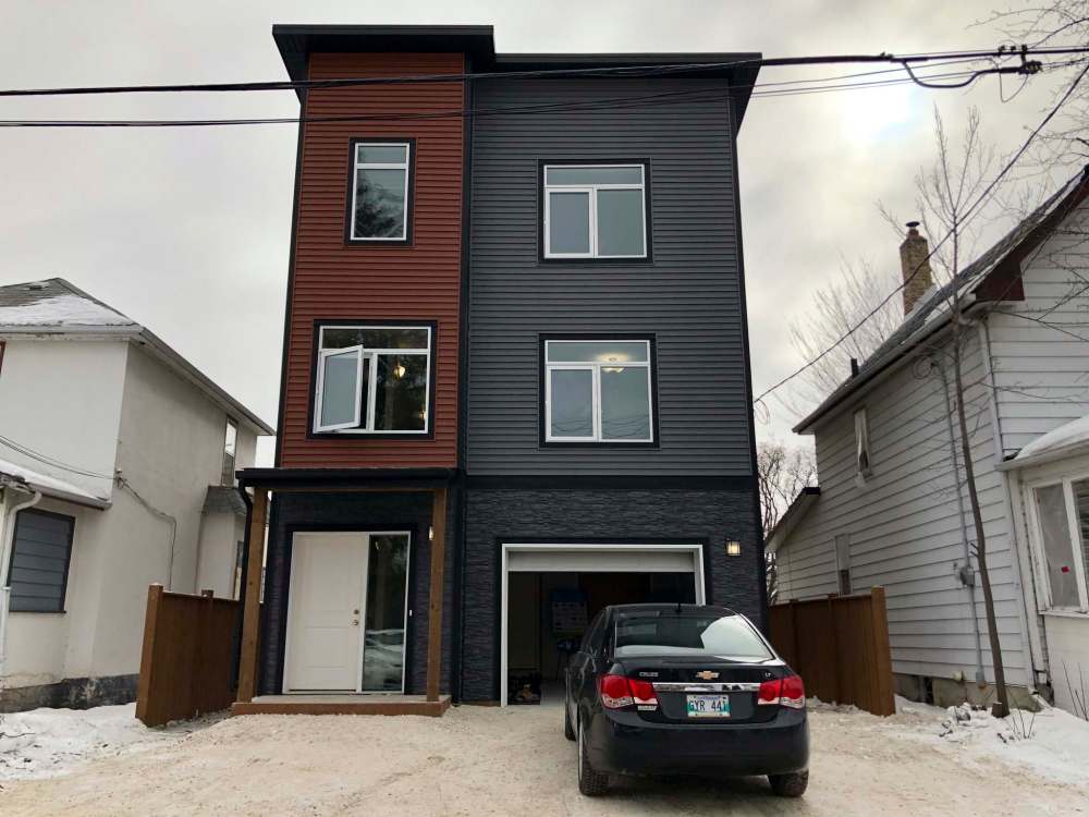 Zekarias Ghabrs, who holds two jobs, worked for 500 hours helping to build the Point Douglas home alongside the organization’s volunteers and staff members. (Maan Alhmidi / Winnipeg Free Press)