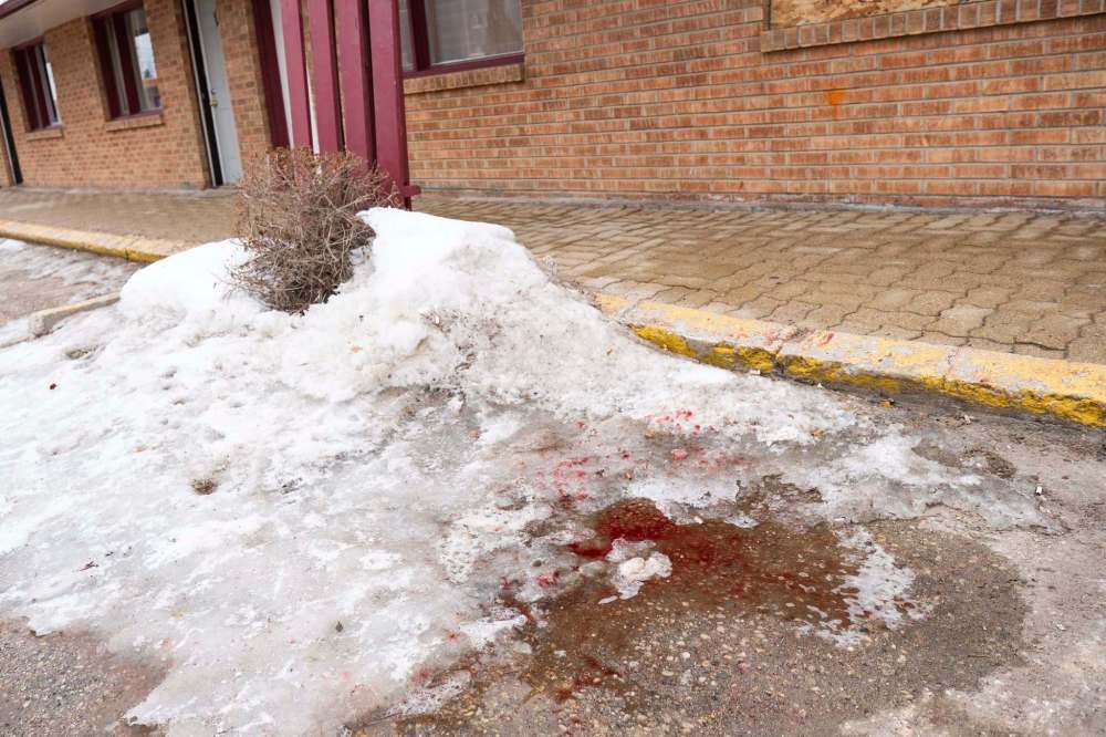 Daniel Crump / Winnipeg Free Press
Blood stains the parking lot of the Capri Motel on Pembina hwy.