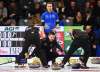 Team Wild Card skip Mike McEwen, middle, calls sweep as Team Alberta skip Brendan Bottcher looks on during the championship round at the Brier in Kingston, Ont. on Friday. (Sean Kilpatrick/The Canadian Press)