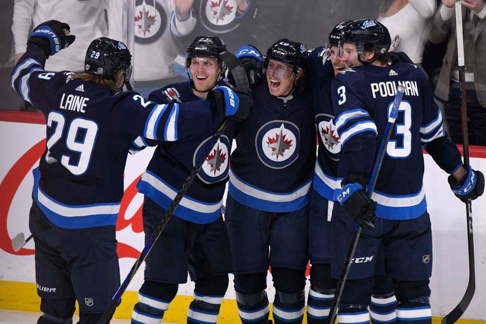 Stay one metre apart, boys. Goal-scoring celebrations are done for the season. (Fred Greenslade / The Canadian Press files)