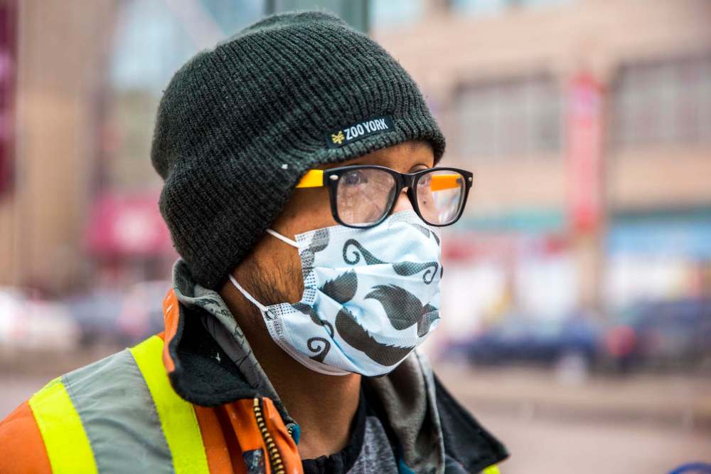Jerson Salas needs to use the bus to get to work, but has been keeping to himself otherwise. (Mikaela MacKenzie / Winnipeg Free Press)