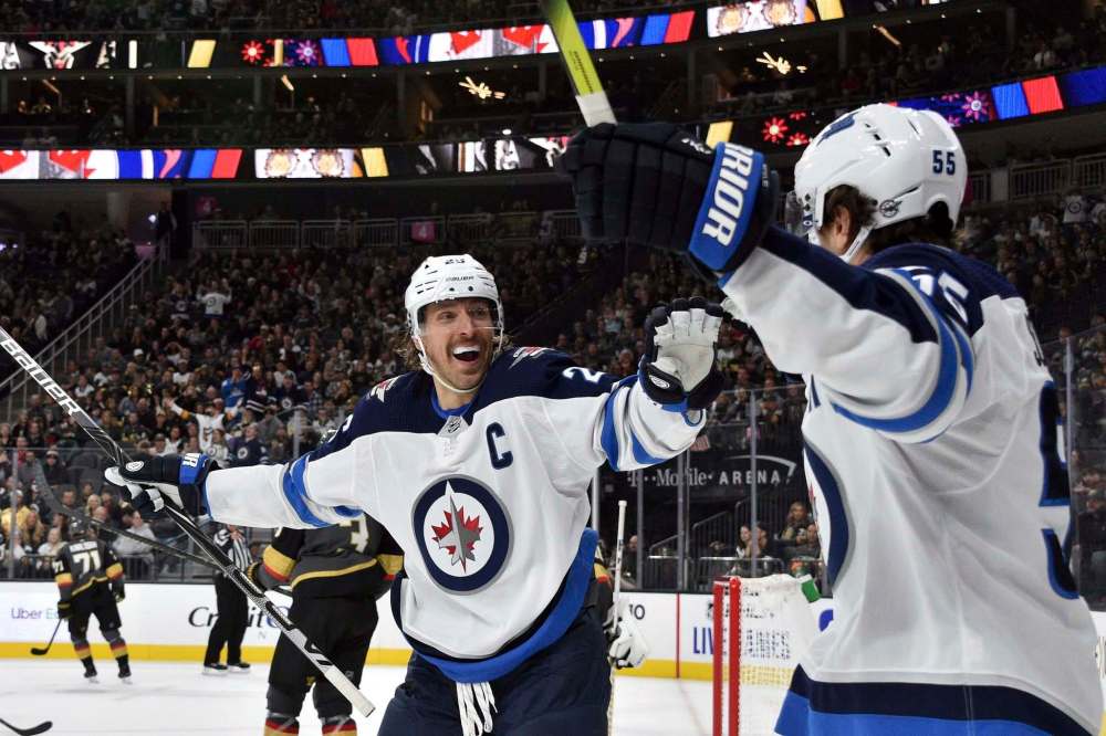 David Becker / The Associated Press files
‘Obviously yeah we’re playing good hockey right now and we’re pushing for a playoff spot, fighting for our lives. But it’s not as important as everything else,’ Jets captain Blake Wheeler says of suspended NHL play.