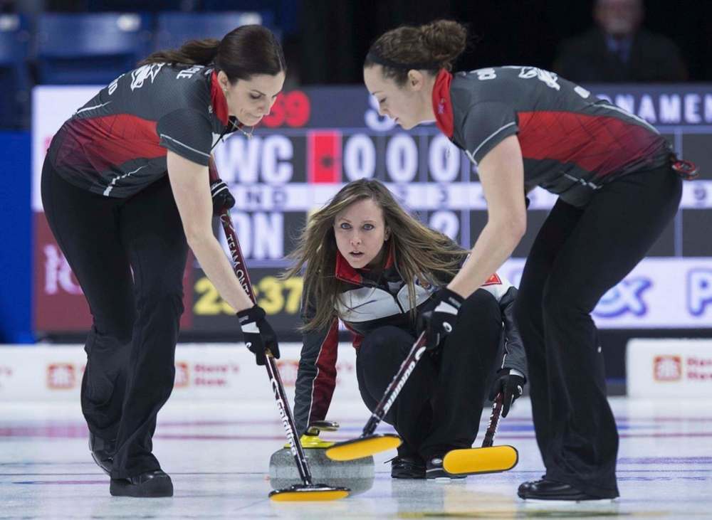 THE CANADIAN PRESS/Andrew Vaughan
Ontario skip Rachel Homan delivers a rock as lead Lisa Weagle, left, and second Joanne Courtney sweep at the 2019 Scotties Tournament of Hearts. Weagle, let go last week after a decade-long run with Rachel Homan's rink, has joined Team Jennifer Jones.