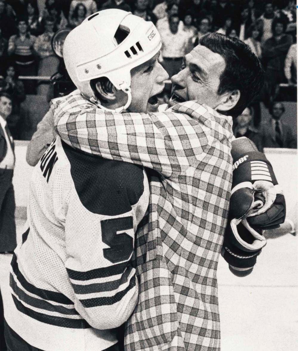PAUL DELESKE / WINNIPEG FREE PRESS FILES
Jets coach Tom McVie, who stepped behind the bench late in the season, celebrates the Jets championship with defenceman Kim Clackson.