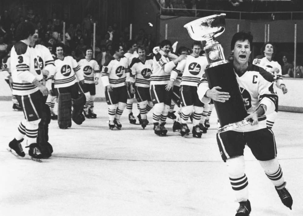 JON THORDARSON / WINNIPEG FREE PRESS FILES
Winnipeg Jets captain Lars-Erik Sjoberg carries the Avco Cup around the rink at the Winnipeg Arena after the Jets beat the Edmonton Oilers 7-3, May 20, 1979, to capture the final WHA championship.