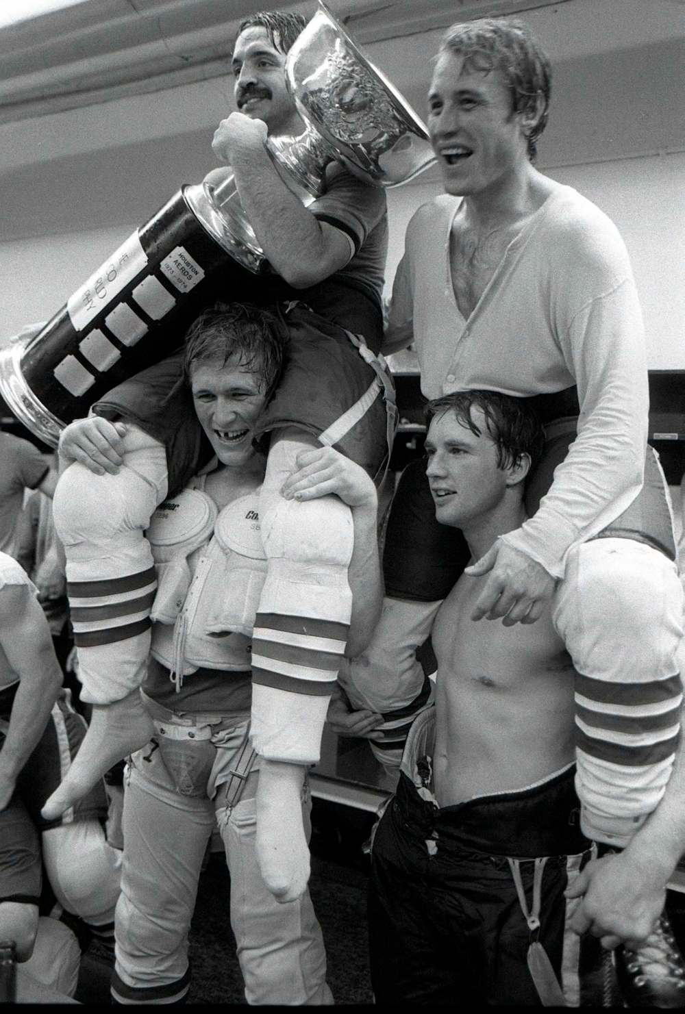 JON THORDARSON / WINNIPEG FREE PRESS FILES
Terry Ruskowski hugs the Avco Cup while sitting on the shoulders of Scott Campbell, teammate Lyle Moffat joins the celebration while sitting on the shoulders of rugged defenceman Kim Clackson.