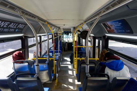 Transit riders maintain their distance on a bus ride Monday. Public health requirements call for 'reasonable separation' between passengers. (Jesse Boily / Winnipeg Free Press)