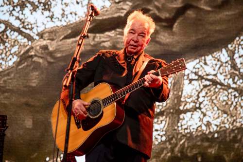 Photo by Amy Harris/Invision/AP, File
John Prine performs at the Bonnaroo Music and Arts Festival in Manchester, Tenn. Prine died Tuesday from complications of the coronavirus. He was 73.