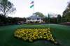 Bright yellow flowers in the shape of the United States adorn the lawn at the clubhouse during the 2006 Masters. The coronavirus pandemic has shut down sporting events around the world. (David J. Phillip / The Associated Press files)