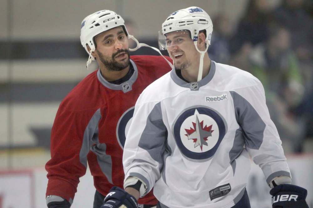 JOE BRYKSA / WINNIPEG FREE PRESS FILES
Winnipeg Jets forward Mark Scheifele, right, misses the jocularity that jumbo teammate Dustin Byfuglien, left, would bring to the game.