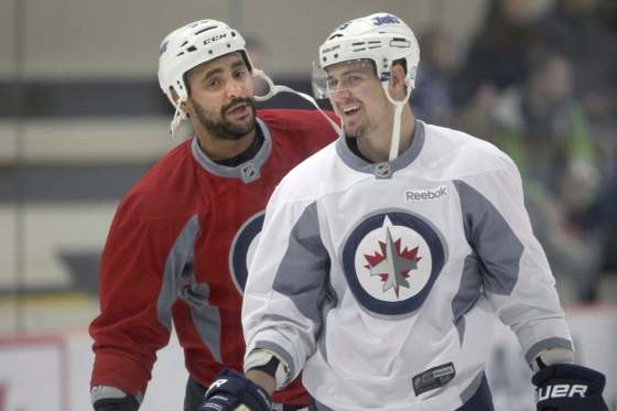 JOE BRYKSA / WINNIPEG FREE PRESS FILESWinnipeg Jets forward Mark Scheifele, right, misses the jocularity that jumbo teammate Dustin Byfuglien, left, would bring to the game.