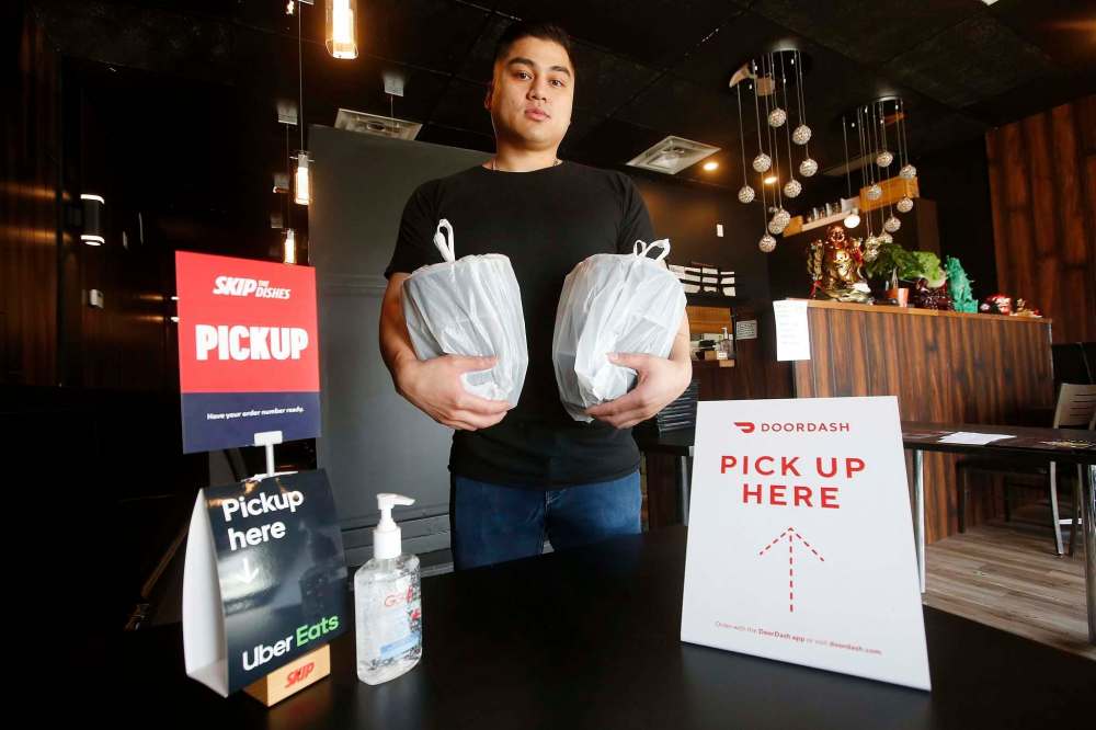 JOHN WOODS / WINNIPEG FREE PRESS
Peter Truong, co-owner of Kyu Bistro, finds it challenging to run a takeout and delivery service. He is considering starting his own delivery service.