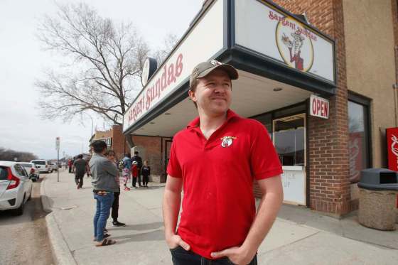 JOHN WOODS / WINNIPEG FREE PRESSAndrew Dusessoy, manager of Sargent Sundae, and his staff were serving up ice cream to a lengthy lineup of people on opening day Sunday.