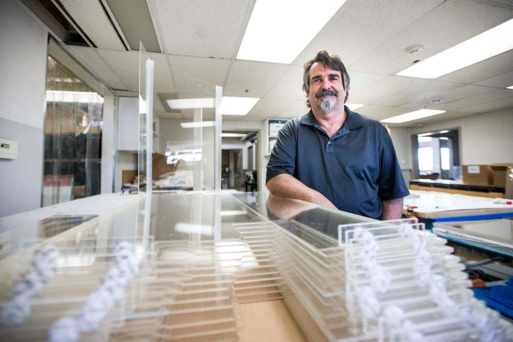 MIKAELA MACKENZIE / WINNIPEG FREE PRESS
John Wardrope, owner of Acryl Design, with freshly made cough guards in his shop in Winnipeg.