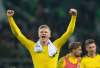 (Bernd Thissen/dpa via AP) 
Erling Haaland and Bundesliga's Borussia Dortmund will make a return to action against Schalke in front of 81,000 empty seats at Westfalenstadion this weekend.