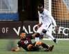 JOHN WOODS / WINNIPEG FREE PRESS FILES
Valour FC&rsquo;s Marco Bustos gets dumped by FC Edmonton&rsquo;s Oumar Diouck during Canadian Premier League action in Winnipeg last August. League officials are looking into a single-site solution that would allow teams to play matches during the COVID-19 pandemic.