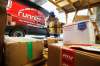 JOHN WOODS / WINNIPEG FREE PRESS
Mike Caners of Runnin’ Red, a cross-border courier, unloads packages from Emerson in their warehouse. Runnin’ Red co-owner Trevor Froese says that currently they are probably doing four to five times the normal volume.