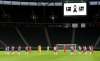 Players observe a minute's silence to commemorate the victims of the coronavirus pandemic prior to the German Bundesliga soccer match between Hertha BSC Berlin and 1. FC Union Berlin in Berlin, Germany, Friday, May 22, 2020. The German Bundesliga is the world's first major soccer league to resume after a two-month suspension because of the coronavirus pandemic. (Stuart Franklin/Pool Photo via AP)