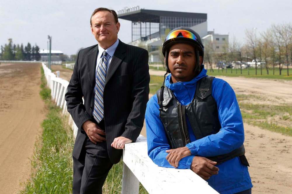 Assiniboia Downs CEO Darren Dunn and jockey Richard Mangalee. Dunn says he is happy the government allowed the track to open. Mangalee says the empty stands won’t affect riders. (John Woods / Winnipeg Free Press)