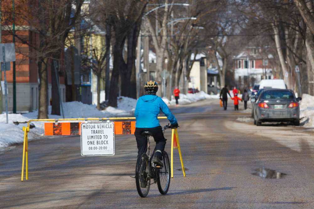 Wolseley Avenue is one of nine routes turned into pedestrian and cyclist corridors in April; between 8 a.m. and 8 p.m., cars are only allowed to travel one block before they must divert onto other streets.City council is now considering extending these restrictions into September. (Mike Deal / Winnipeg Free Press files)