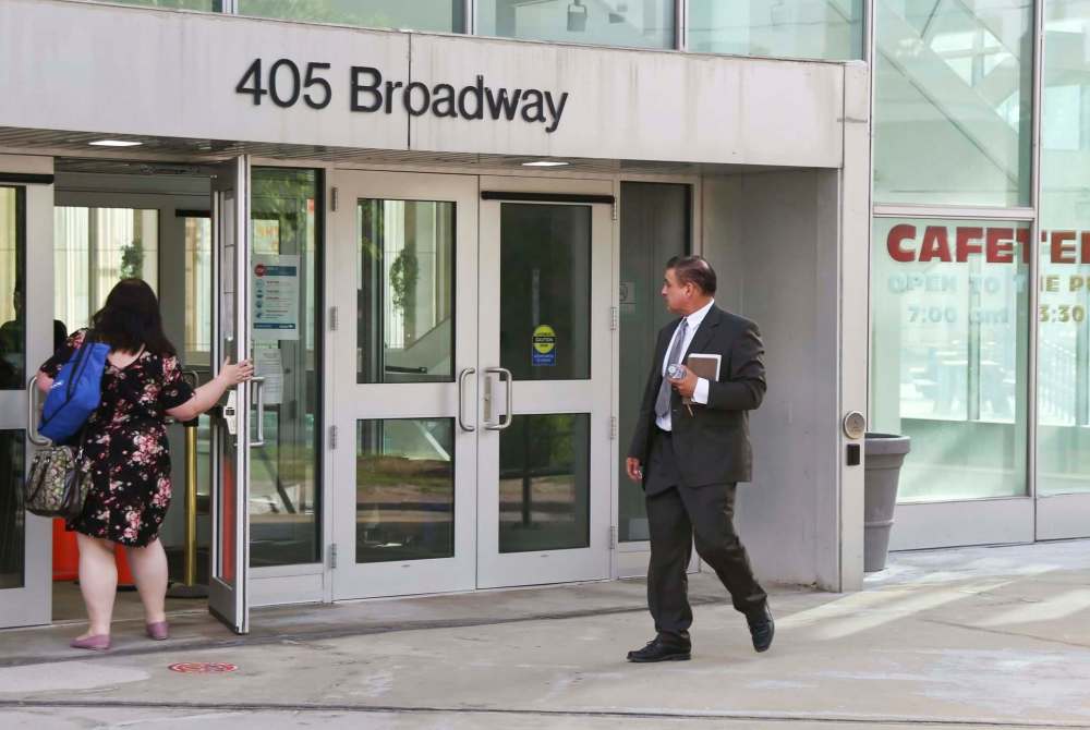 MIKE DEAL / WINNIPEG FREE PRESS
Former firefighter Manuel Ruiz arrives at the entrance to the Law Courts Tuesday for his trial where he has been charged with nine offences, including sexual assault, uttering threats, and forcible entry dating back more than 20 years.