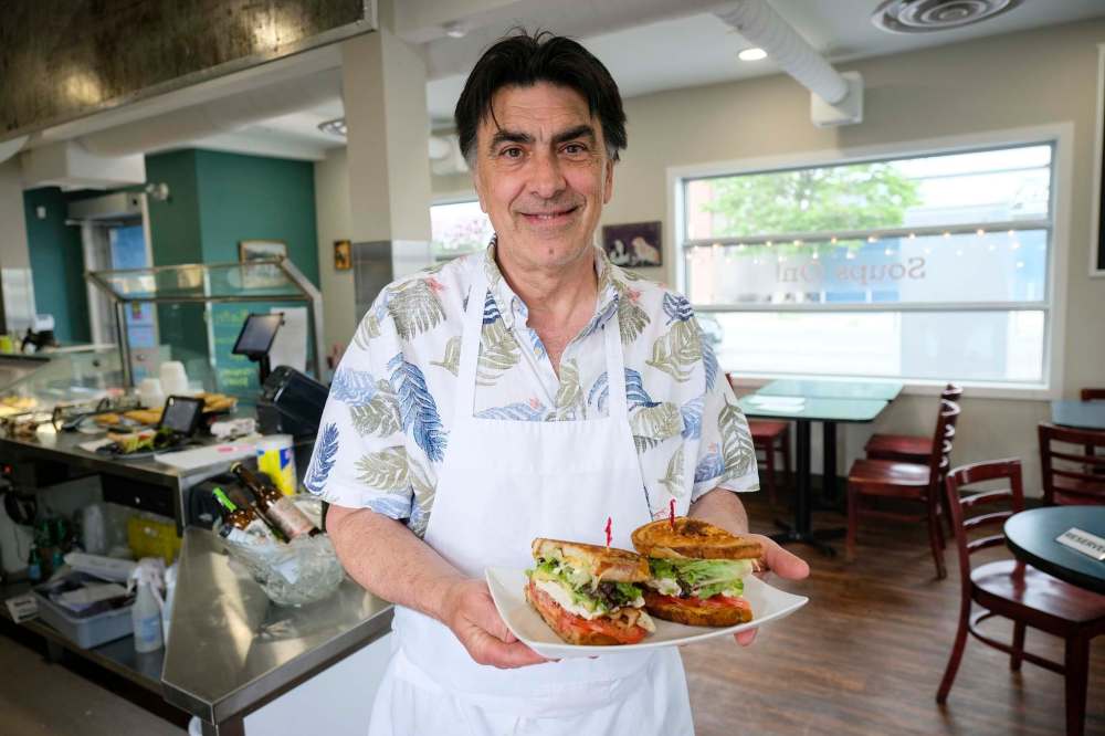 Fern Kirouac, owner of Dug & Betty’s Ice Creamery, with a club sandwich that is made with a special tomato balsamic vinegar jelly.
