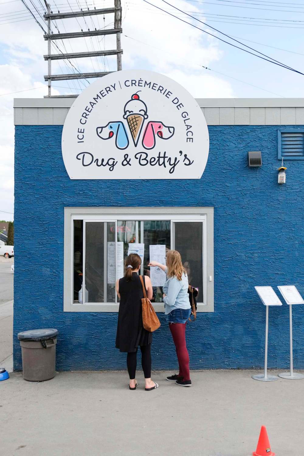 Customers order ice cream from the takeout window.