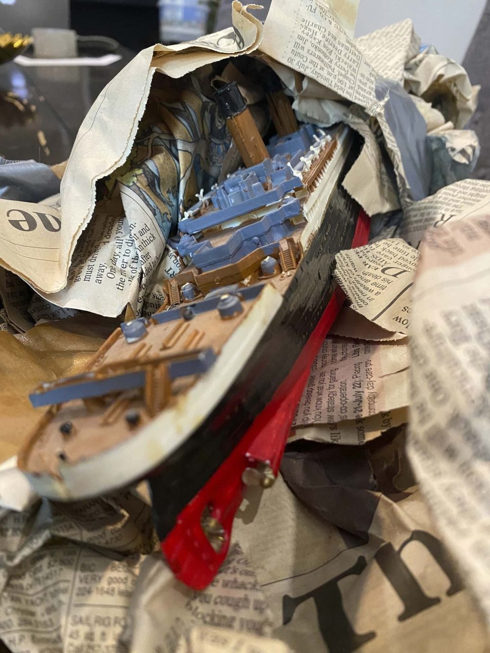 Melissa found the model wrapped in old obituary pages of the Free Press. (Melissa Martin / Winnipeg Free Press)