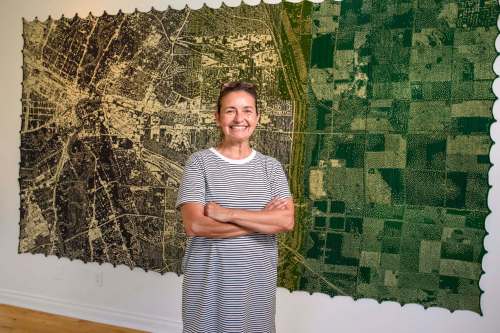 JESSE BOILY / WINNIPEG FREE PRESS
Astrid Alexandra Keim, director of La Maison des artistes visuals francophone, with one of Mylène Michaud&rsquo;s site-specific works inspired by a view of Winnipeg from above.