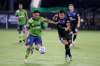 Seattle Sounders midfielder Cristian Roldan, left, moves the ball against San Jose Earthquakes defender Nick Lima during the first half of an MLS soccer match, Friday in Kissimmee, Fla. (AP Photo/John Raoux)